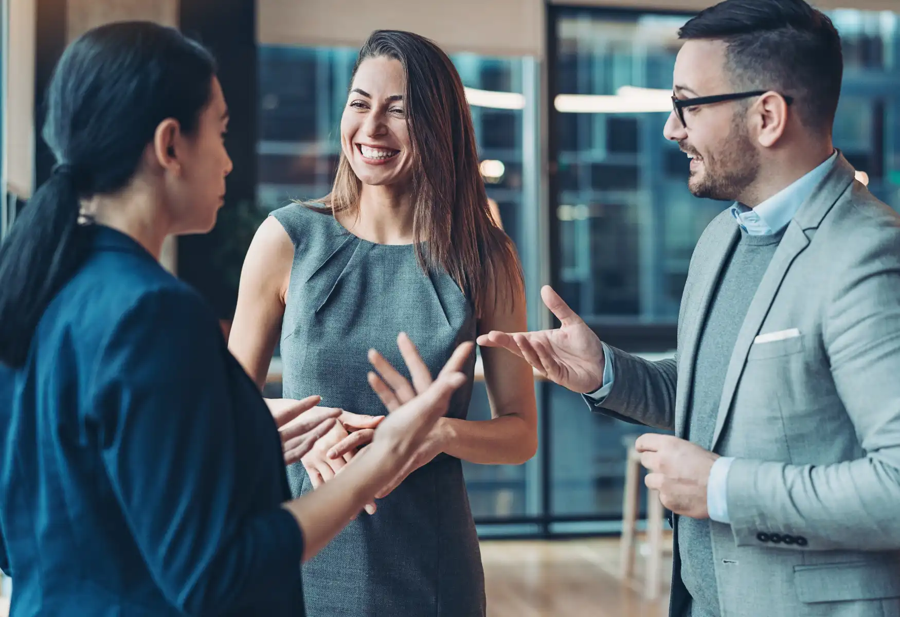 business persons smiling and talking